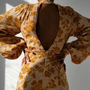 Back View Of A Woman Modeling A Yellow Dress